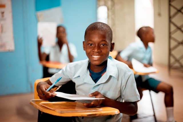 A child learning in a classroom funded by the community