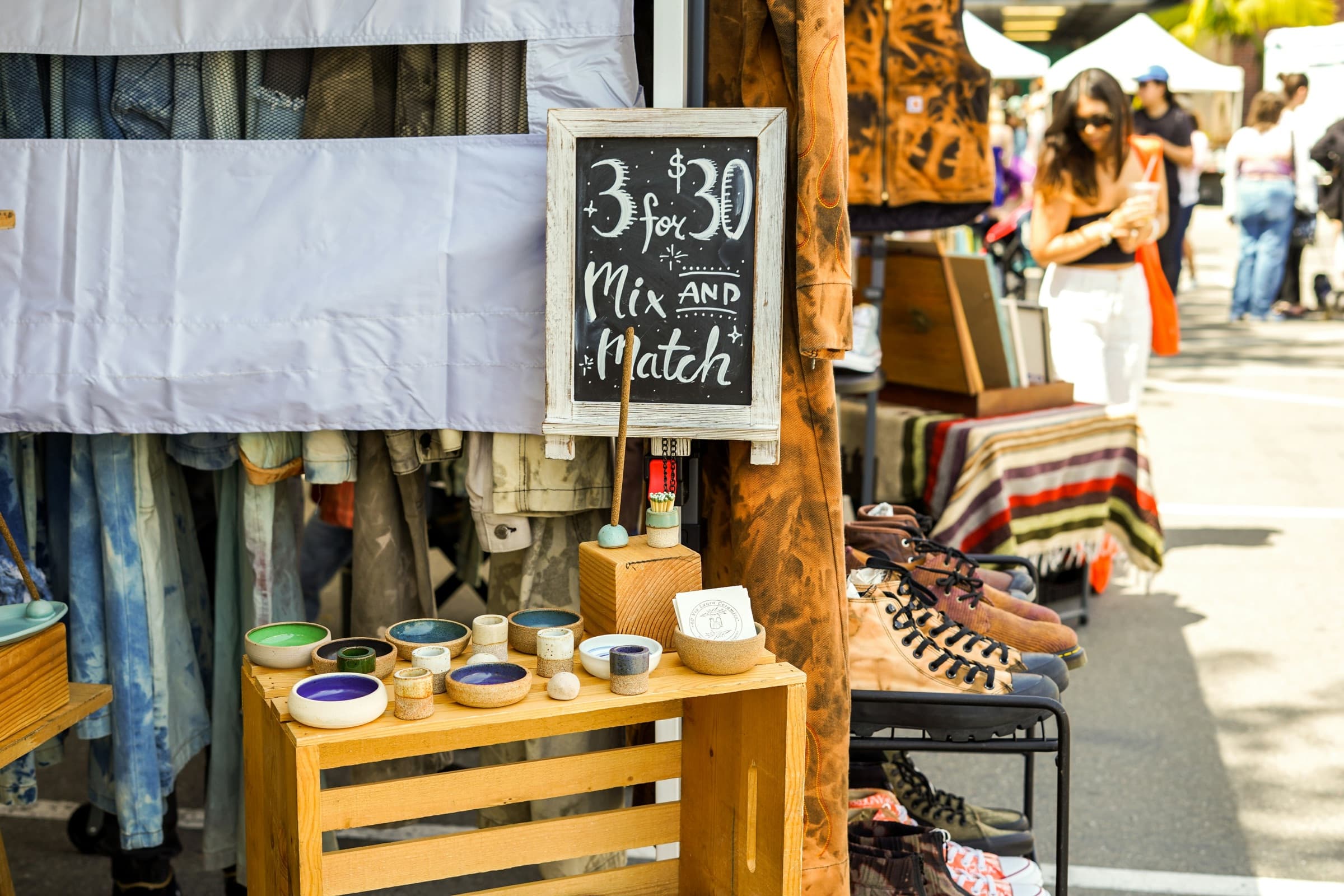 Handmade ceramics arranged on a market table
